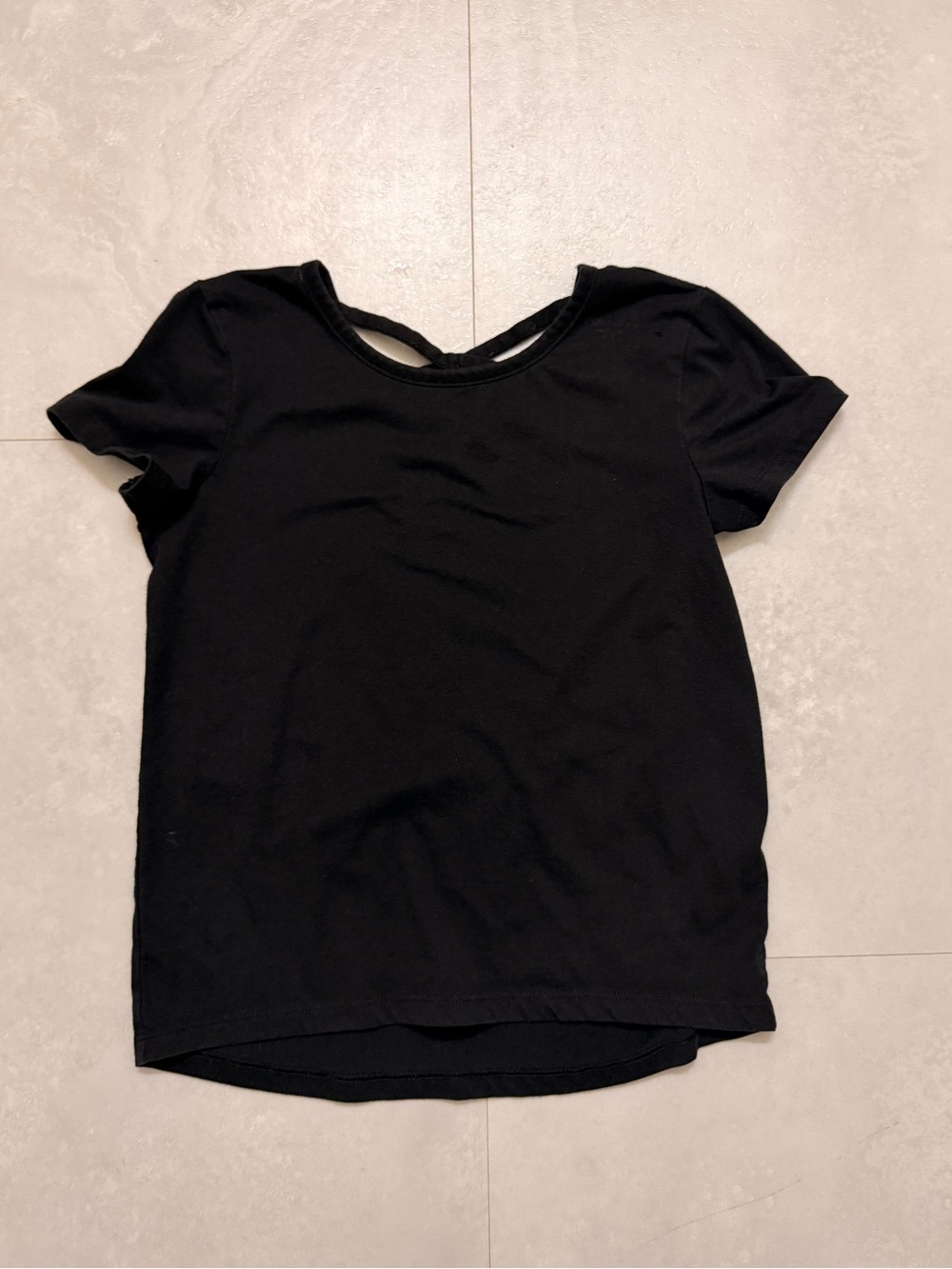 Girls black softest tee with criss cross on back
